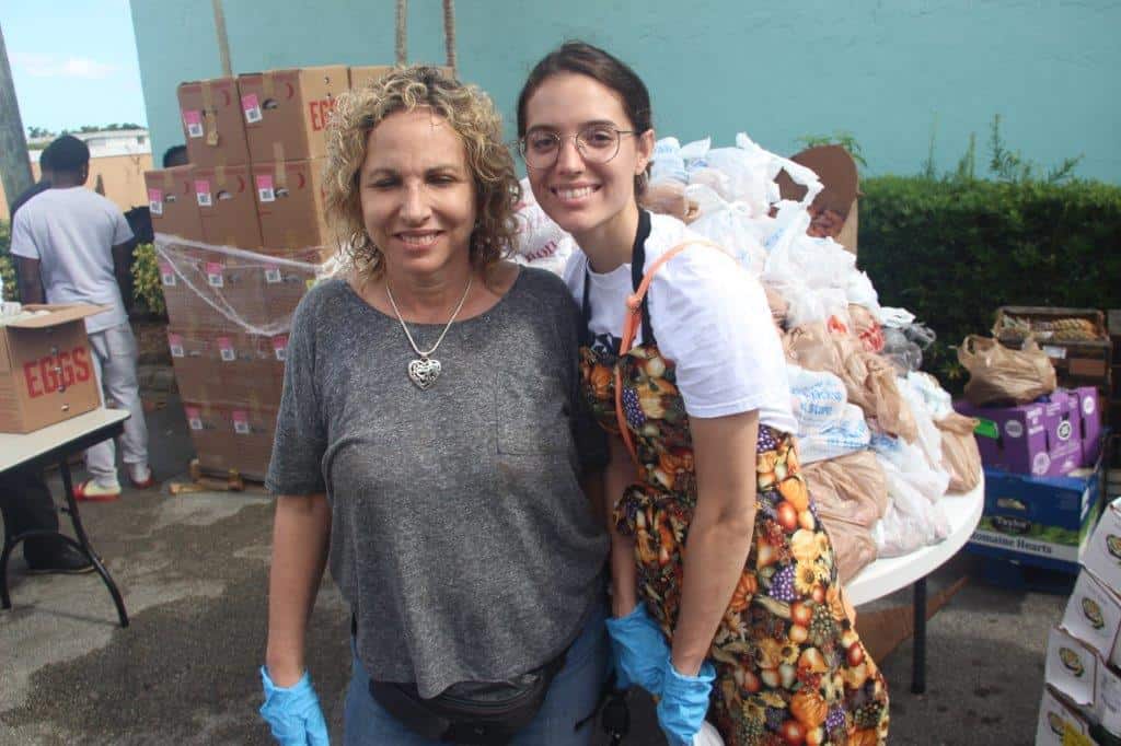 Helene Toll and Brittany Priore volunteers the CEC food giveaway.